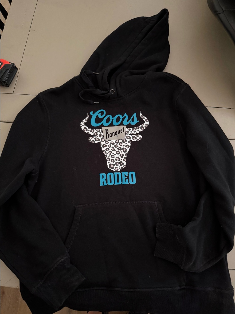Amazon Essentials Black Hoodie with Turquoise Coors Rodeo Graphic